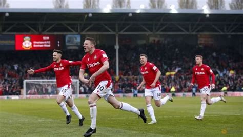 Wrexham seal promotion to English Football League with blockbuster .